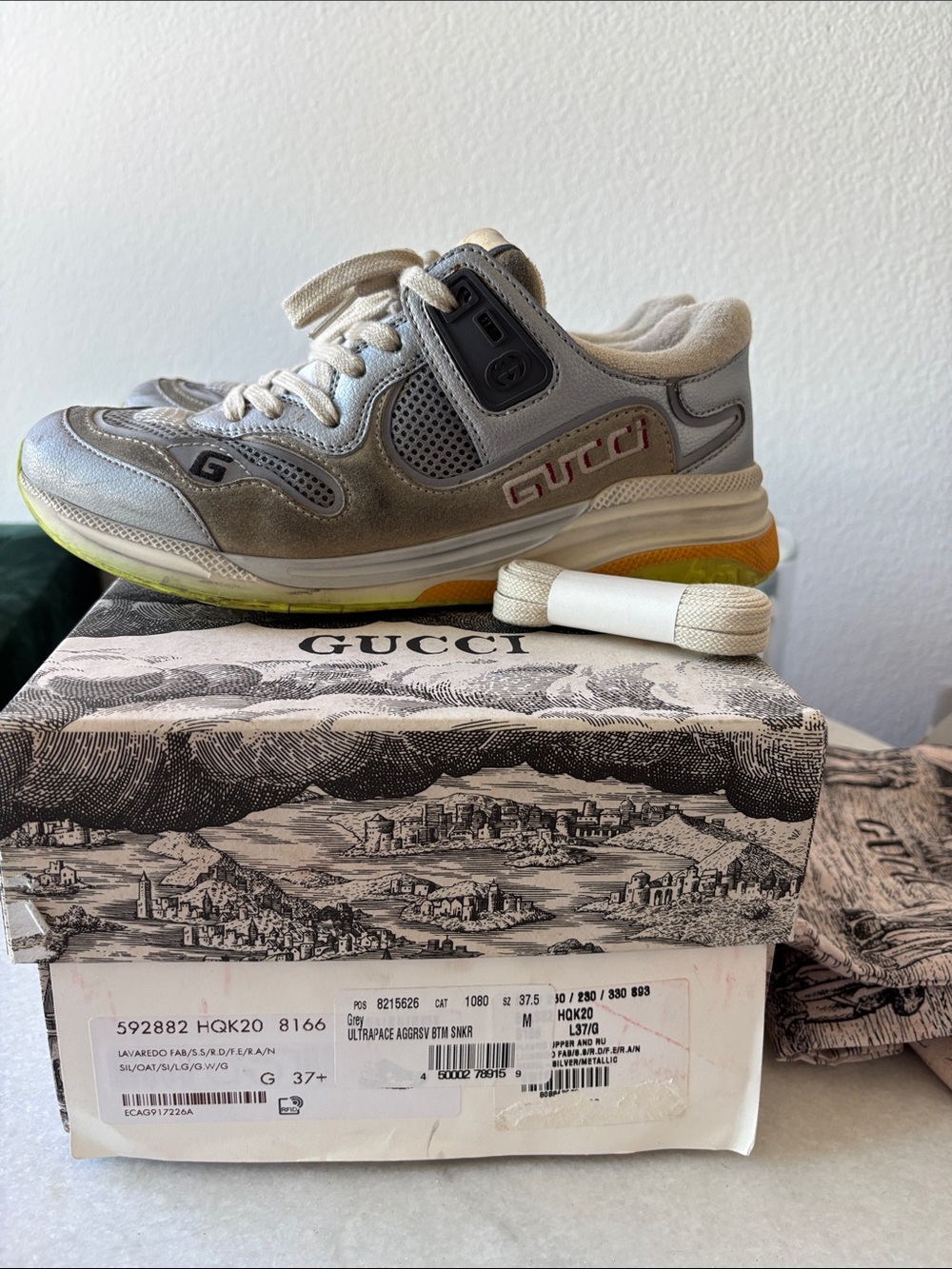 Gucci White & Silver Rhyton-Inspired Sneaker with Yellow-Orange Accent